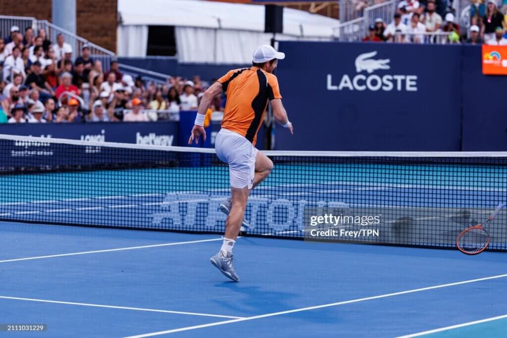 Andy Murray of Great Britain injures his left leg during a rally against Tomas Machac