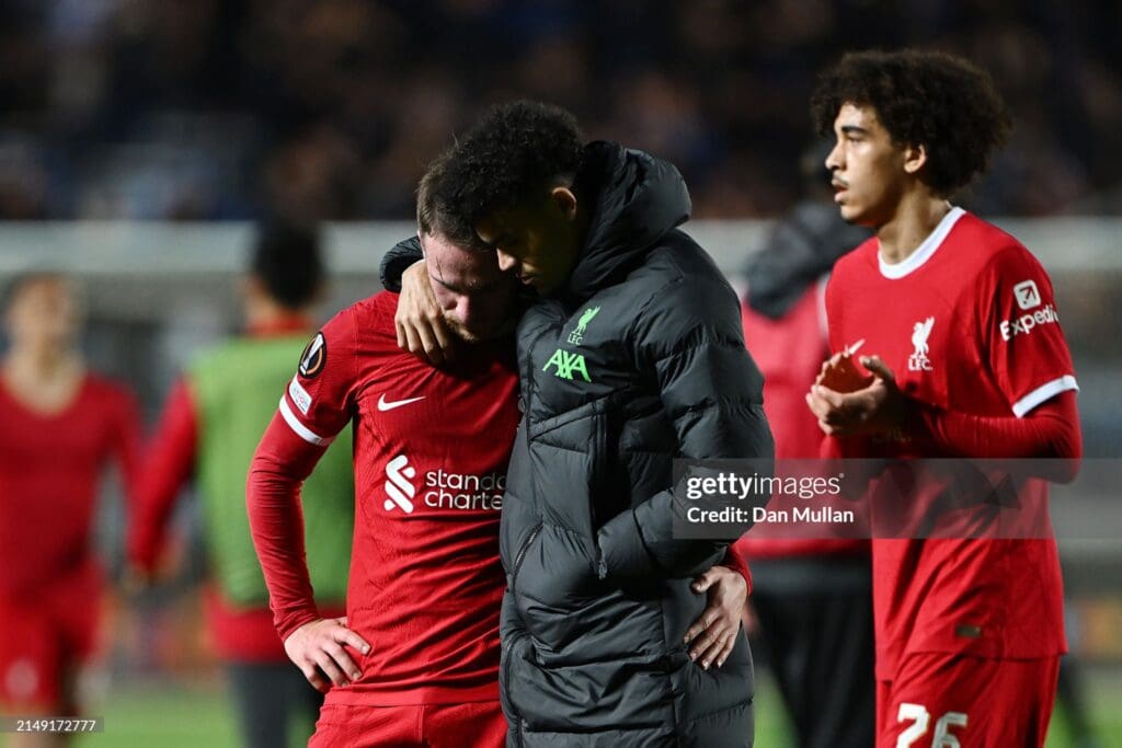 Liverpool player's consoling each other after a game.