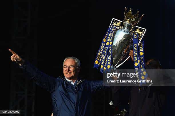 Claudio Ranieri Manager of Leicester City and captain Wes Morgan of Leicester City show the trophy to the fans during the Leicester City Barclays Premier League winners bus parade on May 16, 2016