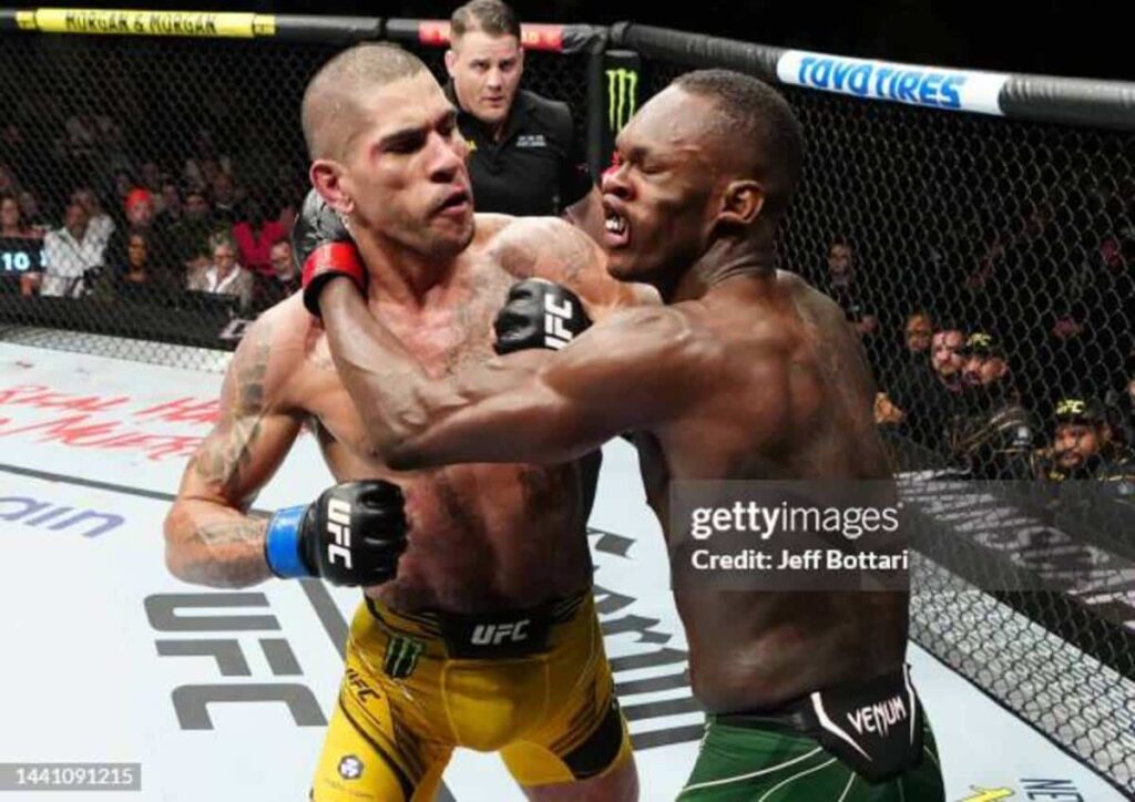 NEW YORK, NEW YORK - NOVEMBER 12: (L-R) Alex Pereira of Brazil punches Israel Adesanya of Nigeria in the UFC middleweight championship bout during the UFC 281 event at Madison Square Garden on November 12, 2022 in New York City. (Photo by Jeff Bottari/Zuffa LLC)