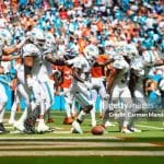 MIAMI GARDENS, FLORIDA - SEPTEMBER 24: Tyreek Hill #10 of the Miami Dolphins and Raheem Mostert #31 celebrate with teammates after Mostert's rushing touchdown during the second quarter against the Denver Broncos at Hard Rock Stadium on September 24, 2023 in Miami Gardens, Florida. (Photo by Carmen Mandato/Getty Images)