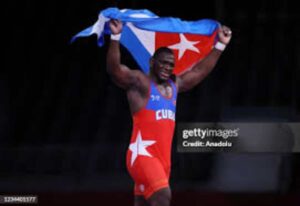 TOKYO, JAPAN - AUGUST 02: Mijain Lopez Nunez of Cuba celebrates his gold medal after defeating Georgia's Iakobi Kajaia in men's greco-roman 130kg wrestling final match during the Tokyo 2020 Olympic Games at the Makuhari Messe in Tokyo, Japan on August 2, 2021. (Photo by Ali Atmaca/Anadolu Agency via Getty Images)