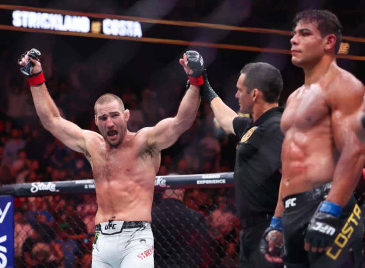 NEWARK, NEW JERSEY - JUNE 01: (L-R) Sean Strickland celebrates defeating Paulo Costa of Brazil in their middleweight bout during UFC 302 at Prudential Center on June 01, 2024 in Newark, New Jersey. (Photo by Luke Hales/Getty Images)