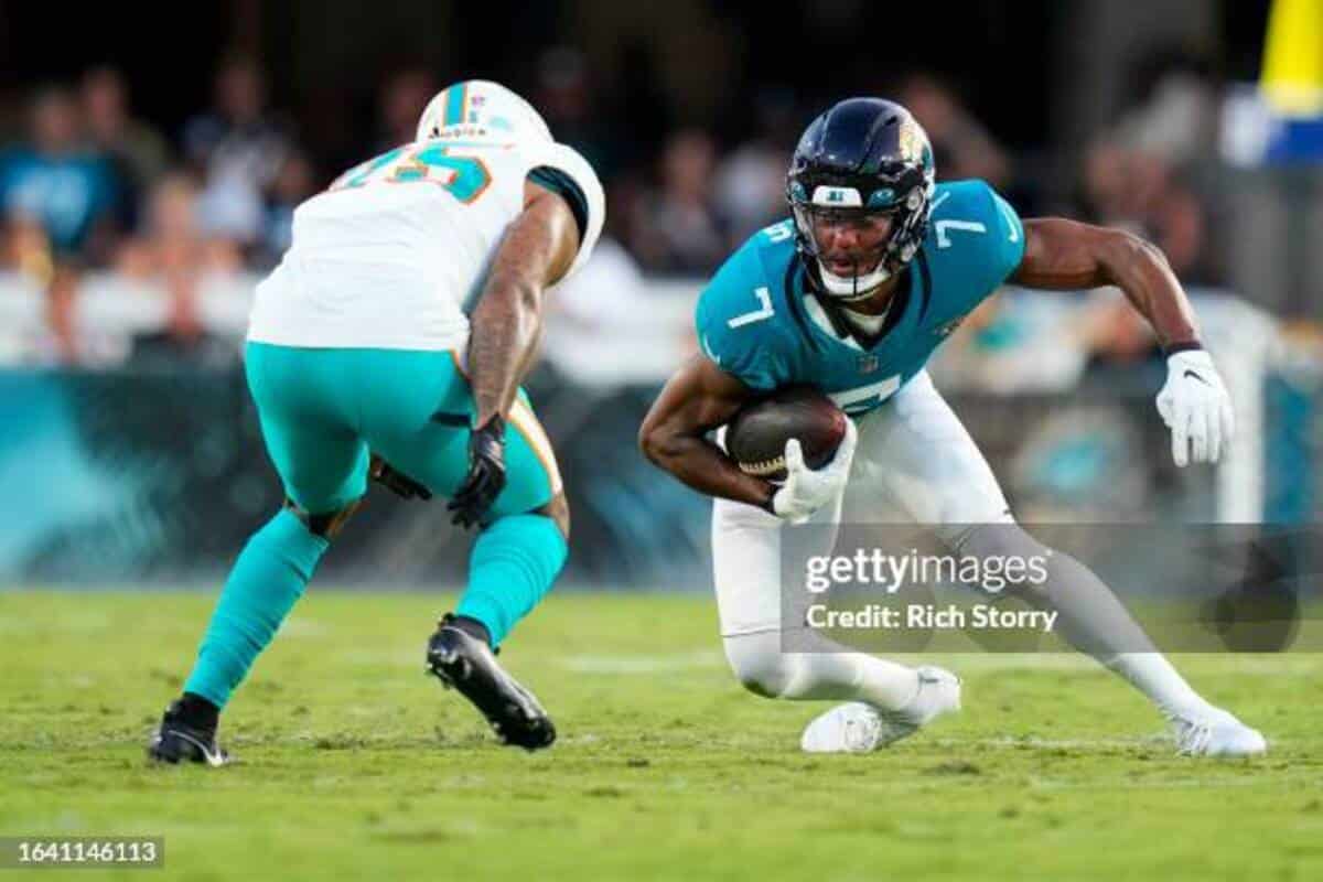 JACKSONVILLE, FLORIDA - AUGUST 26: Zay Jones #7 of the Jacksonville Jaguars runs the ball against the Miami Dolphins during the first half at EverBank Stadium on August 26, 2023 in Jacksonville, Florida. (Photo by Rich Storry/Getty Images)