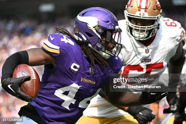 Minnesota Vikings defender Josh Metellus tries to find the endzone after getting an INT from 49ers Brock Purdy