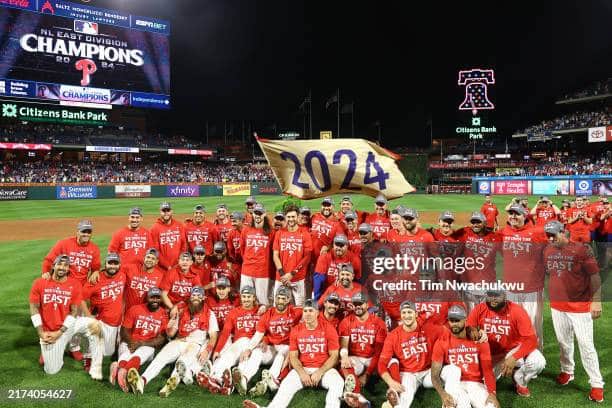 PHILADELPHIA, PENNSYLVANIA - SEPTEMBER 23: The Philadelphia Phillies pose for a team photo after clinching the 2024 NL East Division at Citizens Bank Park on September 23, 2024 in Philadelphia, Pennsylvania.