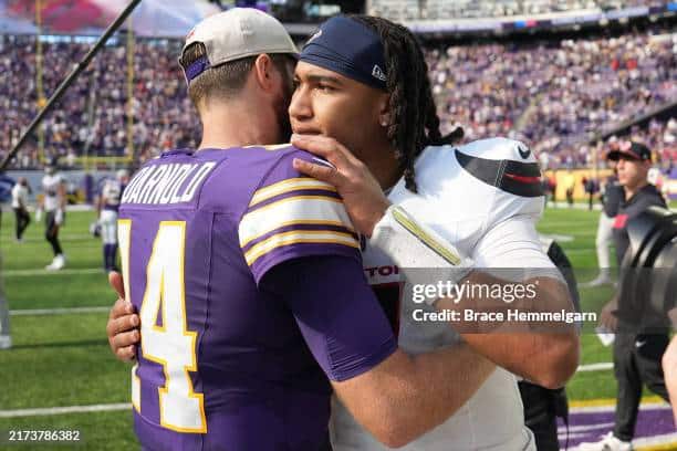 Minnesota Vikings QB Sam Darnold embraces CJ Stroud after a dominant victory by the Vikings