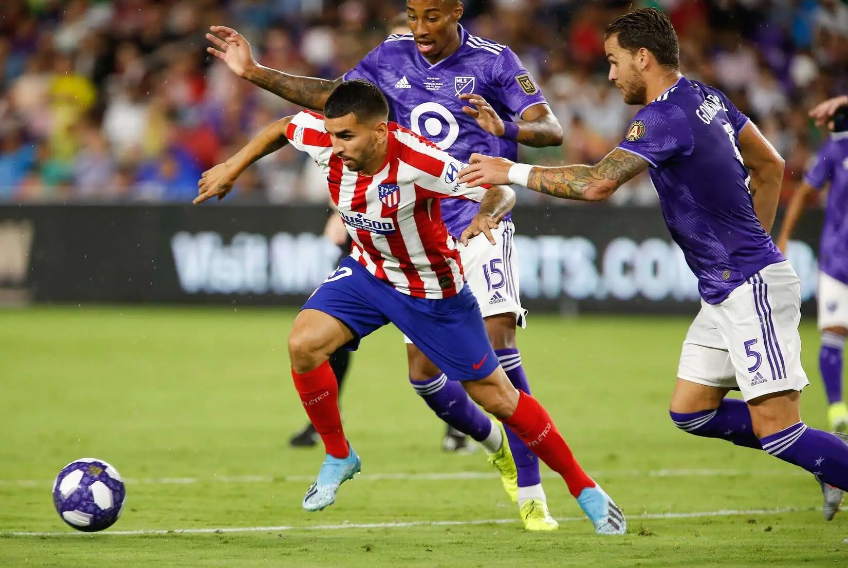 Angel Correa of Atletico Madrid scores late against Real Madrid