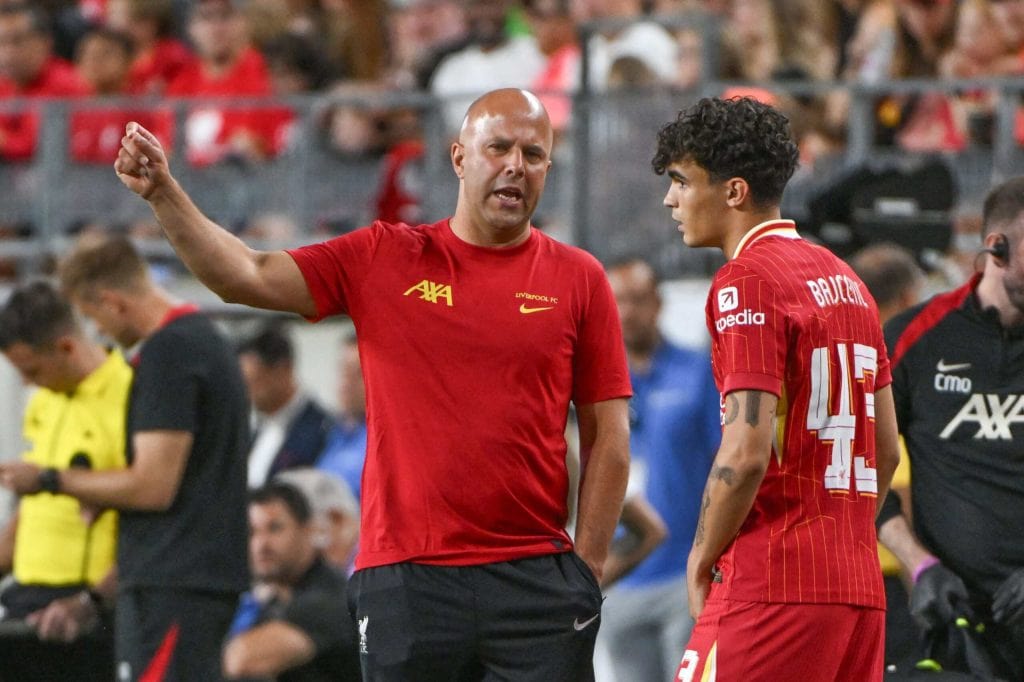 Jul 26, 2024; Pittsburgh, PA, USA; Liverpool manager Arne Slot talks with Liverpool midfielder Stefan Bajcetic (43) during