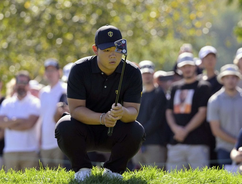 Tom Kim lines up a putt before his Tom Kim Asian Games gold run