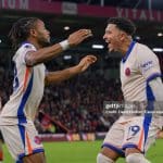 Sancho and Nkunku celebrate after scoring at Bournemouth vs Chelsea