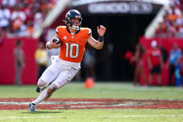 Denver Broncos quarterback Bo Nix throws a pass