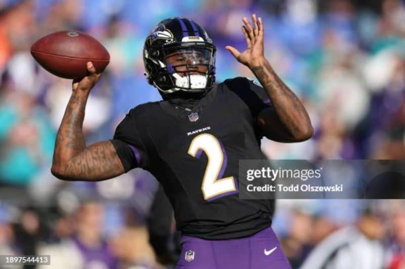 ALTIMORE, MARYLAND - DECEMBER 31: Tyler Huntley #2 of the Baltimore Ravens warms up prior to a fame against the Miami Dolphins at M&T Bank Stadium on December 31, 2023 in Baltimore, Maryland. (Photo by Todd Olszewski/Getty Images) dolphins