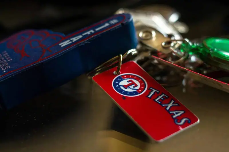 Jacob deGrom. Detailed close-up of a Texas Rangers keychain featuring vibrant colors and logo.