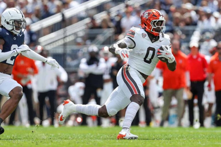 Bowling Green Falcons player runs with the ball in a game; Bowling Green beats Miami in 24-20 win