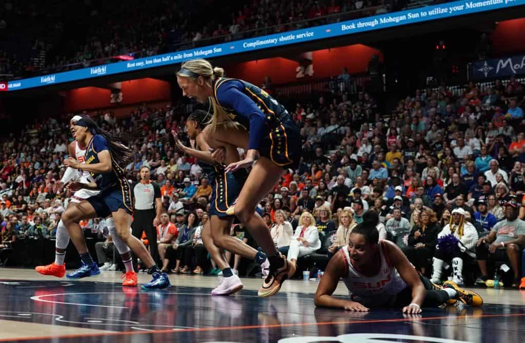 Brian Hartley collides with Sophie Cunningham after pass.