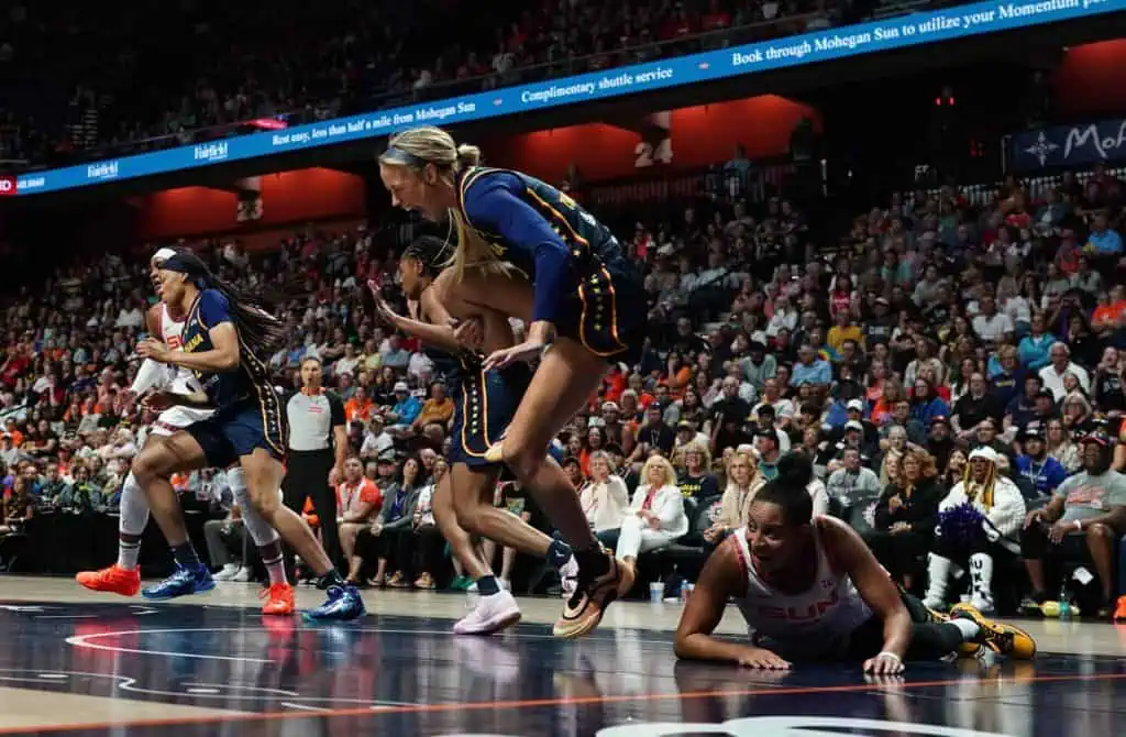 Brian Hartley collides with Sophie Cunningham after pass.