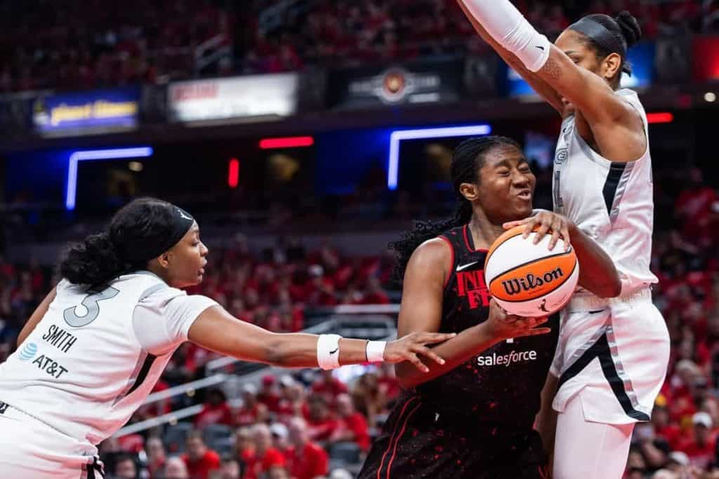 Indiana Fever forward Aliyah Boston shoots as Las Vegas Aces center A'ja Wilson defends in Game 4 of the 2025 WNBA semifinals