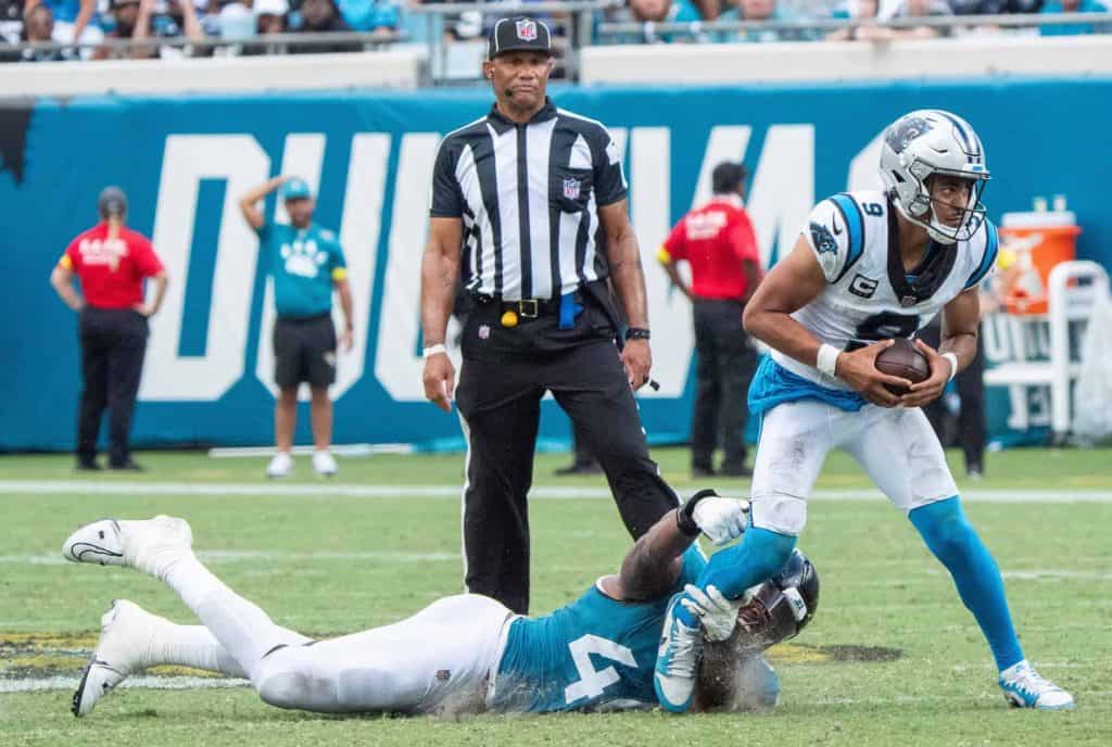 Jacksonville Jaguars defensive end Travon Walker (44) tries to sack Carolina Panthers quarterback Bryce Young (9) during the