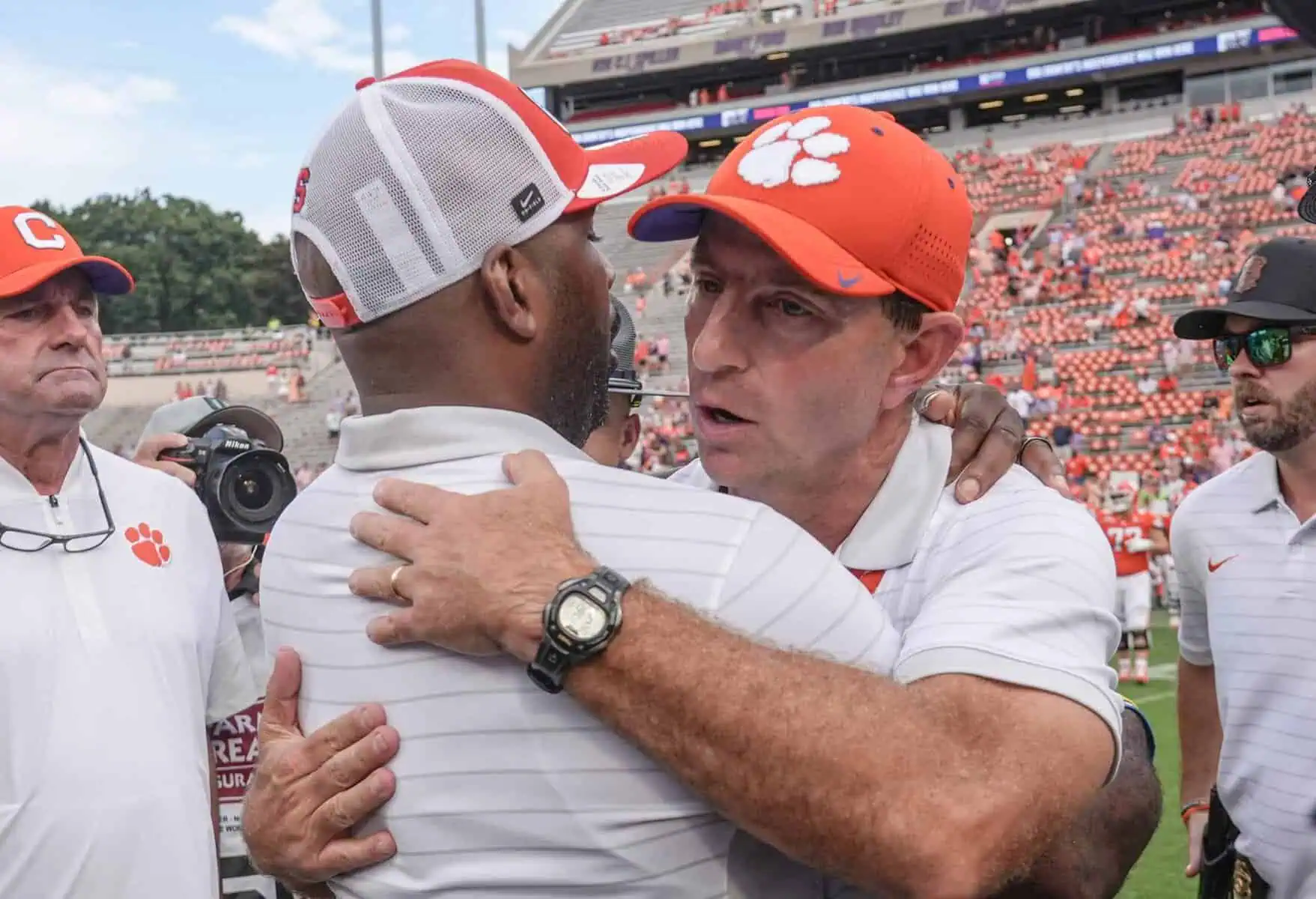 Syracuse coach Fran Brown and Clemson coach Dabo Swinney meet at half field