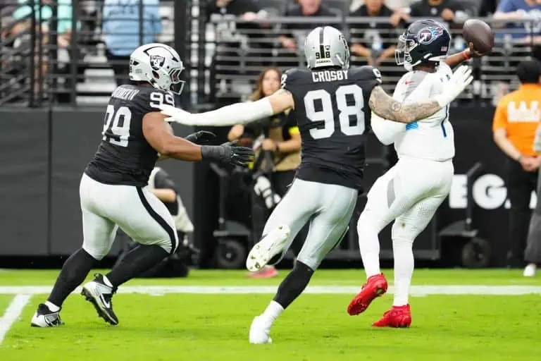 Las Vegas Raiders defensive end Maxx Crosby closes in on Titans QB Cam Ward Image by: Stephen R. Sylvanie-Imagn Images