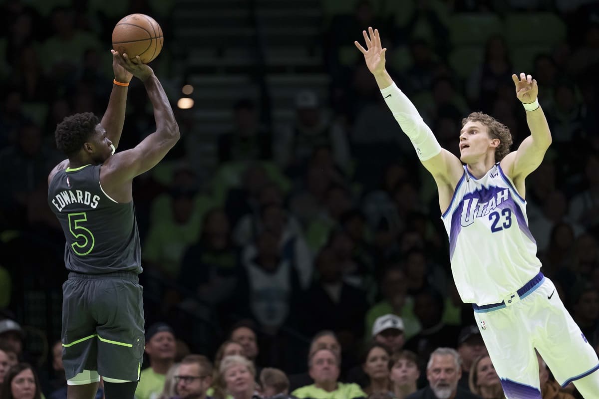 Minnesota Timberwolves guard Anthony Edwards (5) shoots the ball over Utah Jazz forward Lauri Markkanen (23) in the first half at Target Center.