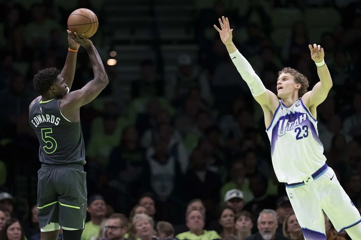Minnesota Timberwolves guard Anthony Edwards (5) shoots the ball over Utah Jazz forward Lauri Markkanen (23) in the first half at Target Center.
