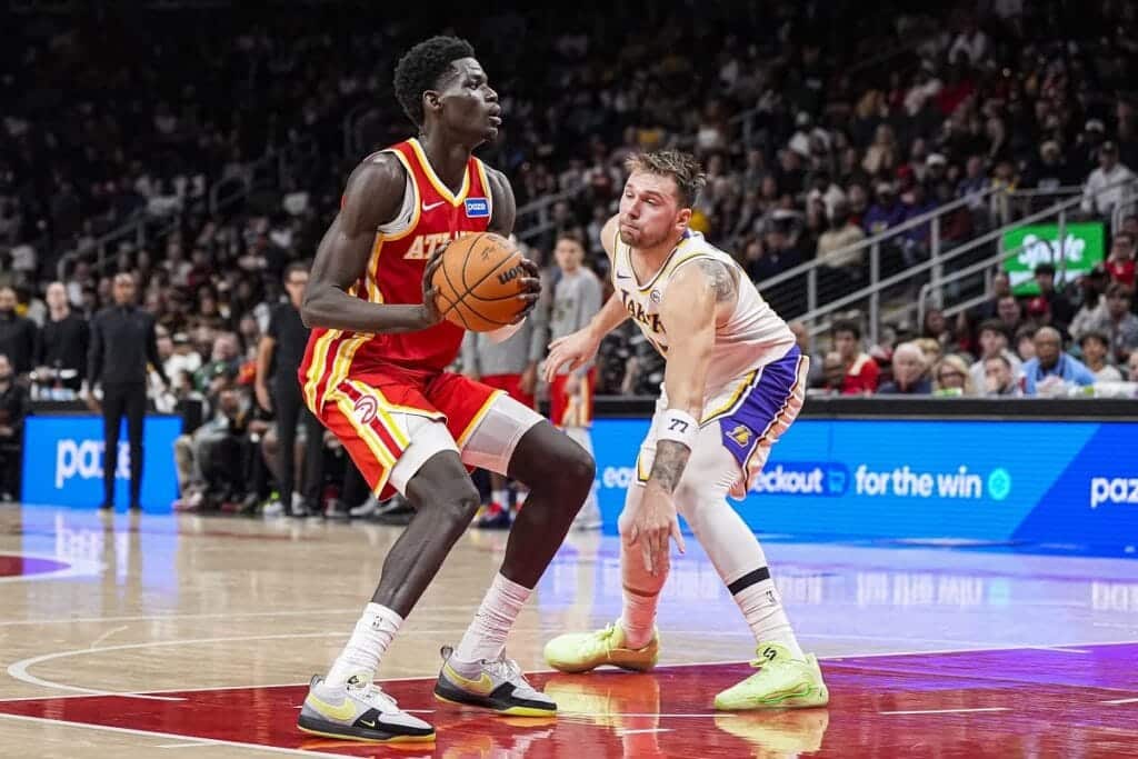 The Atlanta Hawks' Mouhamed Gueye looks to score on the L.A. Lakers' Luka Doncic.