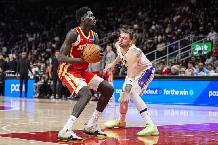 The Atlanta Hawks' Mouhamed Gueye looks to score on the L.A. Lakers' Luka Doncic.