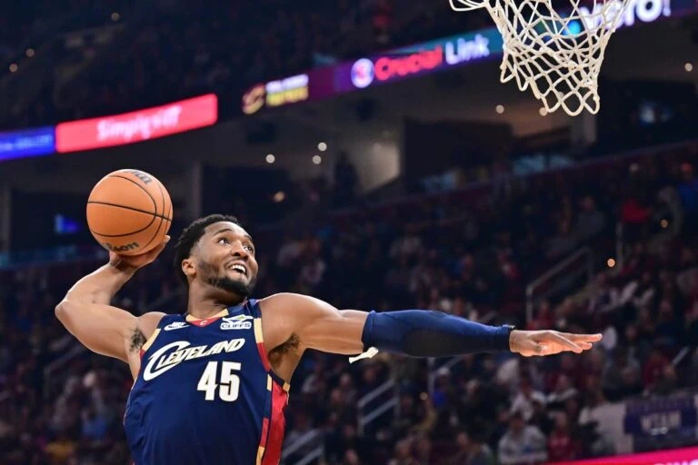 Cleveland Cavaliers guard Donovan Mitchell (45) goes up for a dunk against the Chicago Bulls during the first half at Rocket Arena.