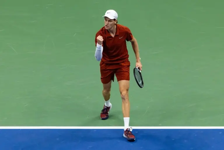 Jannik Sinner celebrates winning a point