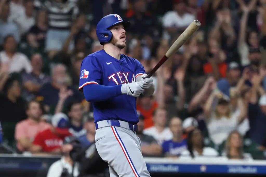 Texas Rangers catcher Jonah Heim swings the bat