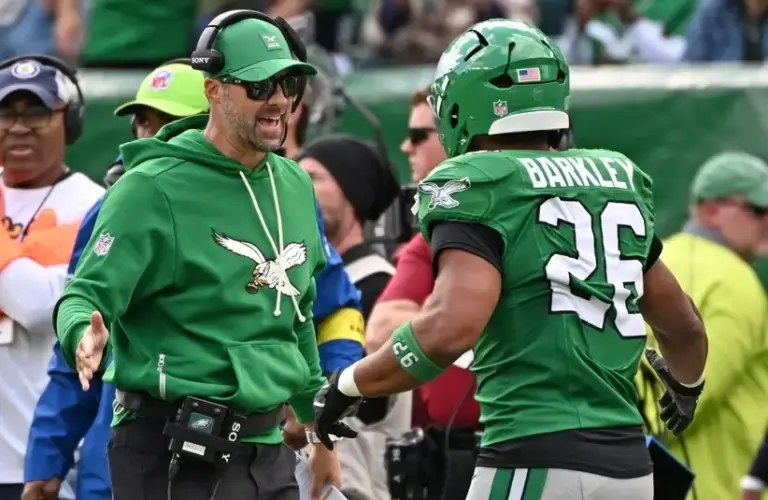 Kevin Patullo high fives Saquon Barkley vs Giants in Week 8