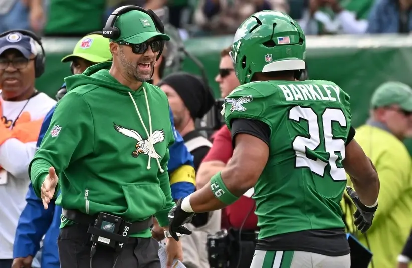 Kevin Patullo high fives Saquon Barkley vs Giants in Week 8