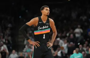 San Antonio Spurs star Victor Wembanyama standing on the court.