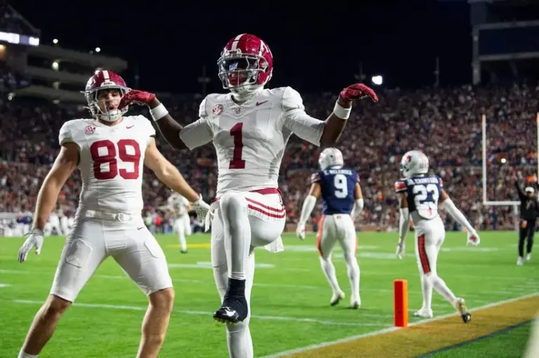 Alabama hangs on to beat Auburn in Iron Bowl.