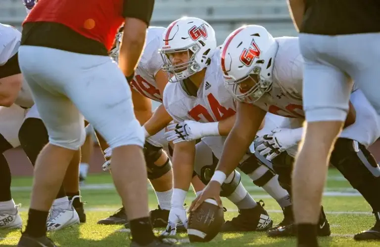 The Grand View Univesrity Vikings football team practices before a big game.