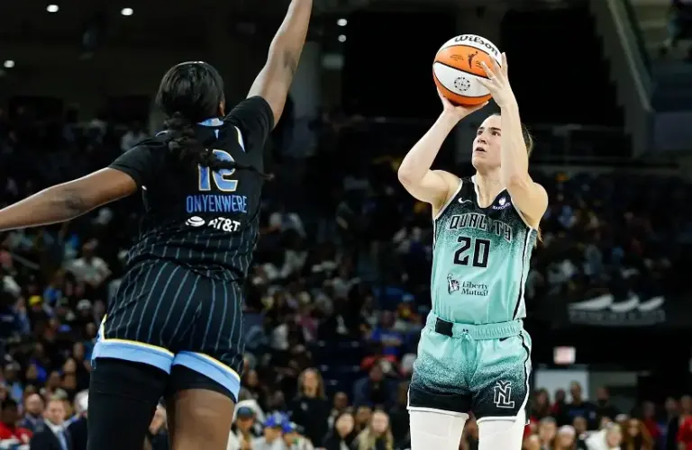 New York Liberty guard Sabrina Ionescu (20) shoots against Chicago Sky forward Michaela Onyenwere (12) during the first half at Wintrust Arena.