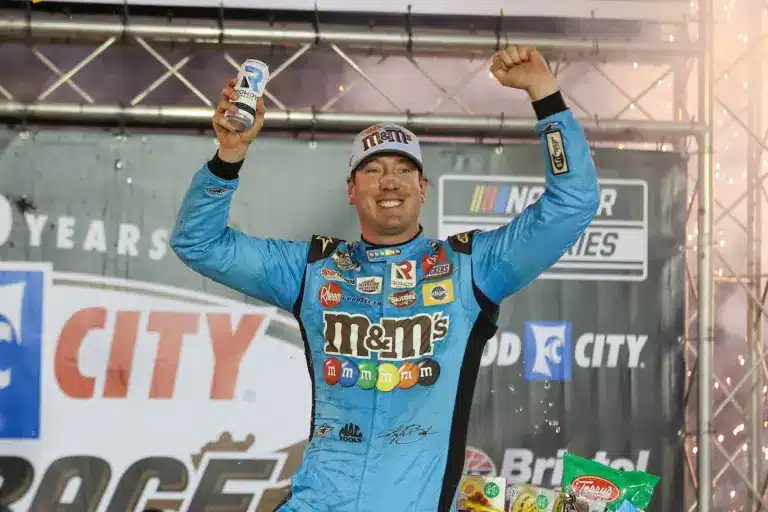 Apr 17, 2022; Bristol, Tennessee, USA; NASCAR Cup Series driver Kyle Busch (18) reacts after winning the Bristol Motor Speedway Dirt Course. Mandatory Credit: Randy Sartin-Imagn Images