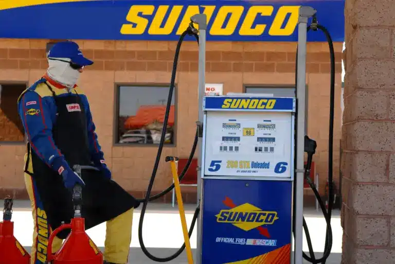 Feb 24, 2007; Fontana, CA, USA; A Sunoco employee fills a gas tank with unleaded fuel in the Nascar Nextel Cup Series garage during practice for the Auto Club 500 at California Speedway. This race marks the first time that Nascar is using unleaded race fuel. Mandatory Credit: Mark J. Rebilas-Imagn Images Copyright © 2007 Mark J. Rebilas