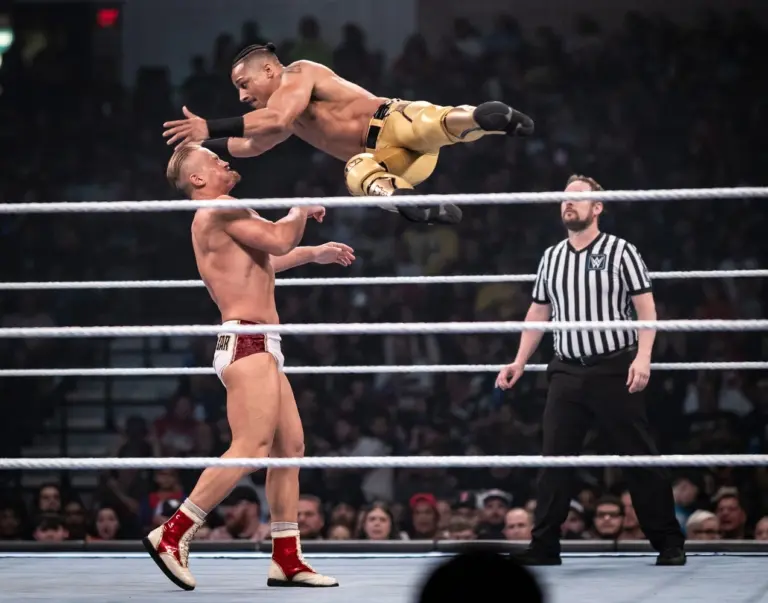 SmackDown; Caption: Carmelo Hayes, right, goes airborne against Ilja Dragunov.