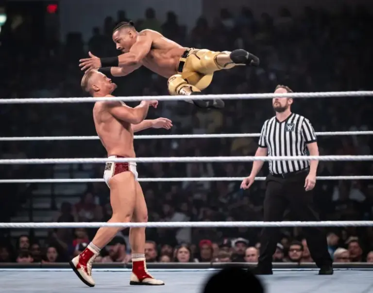 SmackDown; Caption: Carmelo Hayes, right, goes airborne against Ilja Dragunov.
