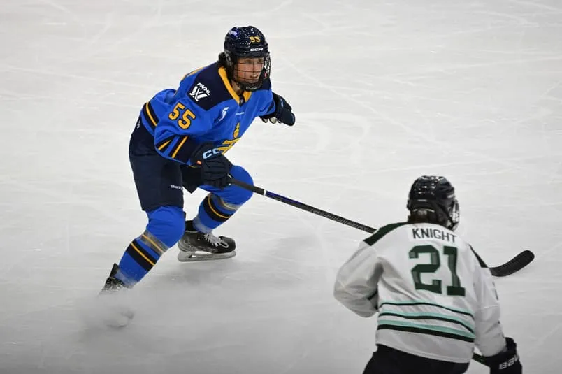 Nov 30, 2024; Toronto, ON, CANADA; Toronto Sceptres defender Ryland MacKinnon (55) defends against Boston Fleet forward Hilary Knight (21) in the third period at Coca-Cola Coliseum. Mandatory Credit: Dan Hamilton-Imagn Images