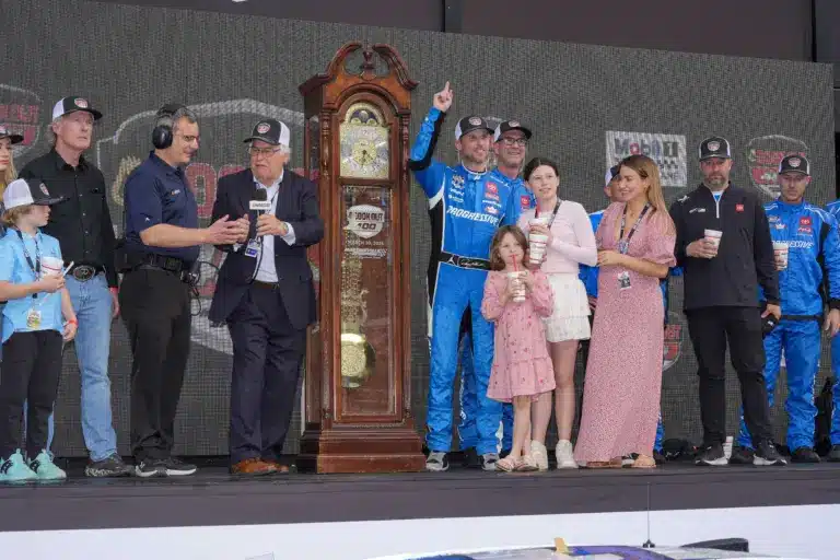 Mar 30, 2025; Martinsville, Virginia, USA; NASCAR Cup Series driver Denny Hamlin (11) and his family celebrate his win at the Cook Out 400 at Martinsville Speedway. Mandatory Credit: Jim Dedmon-Imagn Images