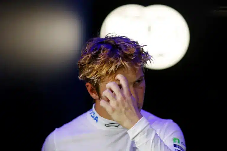 May 3, 2025; Miami Gardens, FL, USA; RB driver Liam Lawson (30) walks out of the FIA garage after missing the final round during qualifying for the F1 Miami Grand Prix at Miami International Autodrome. Mandatory Credit: Peter Casey-Imagn Images