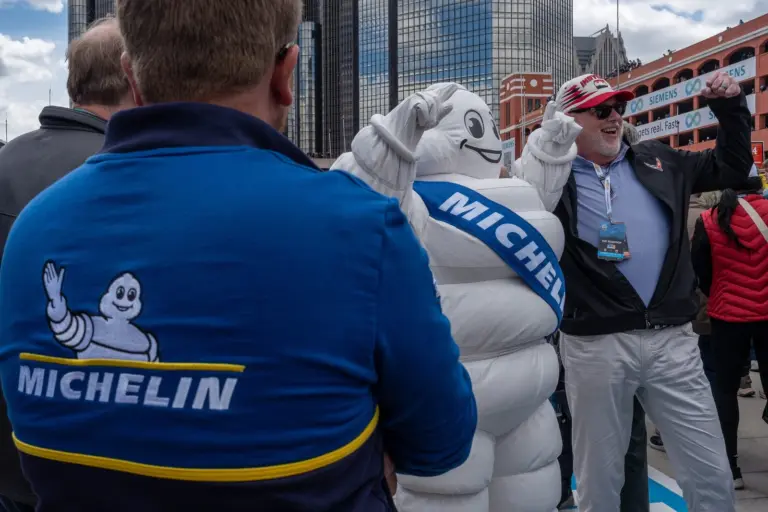 Random Vandals Racing; Rob Fischer takes a photo with the Michelin mascot during the 2025 Detroit Grand Prix presented by Lear in Detroit on Saturday, May 31, 2025. The event featured the IMSA WeatherTech SportsCar Championship’s Chevrolet Detroit Sports Car Classic.