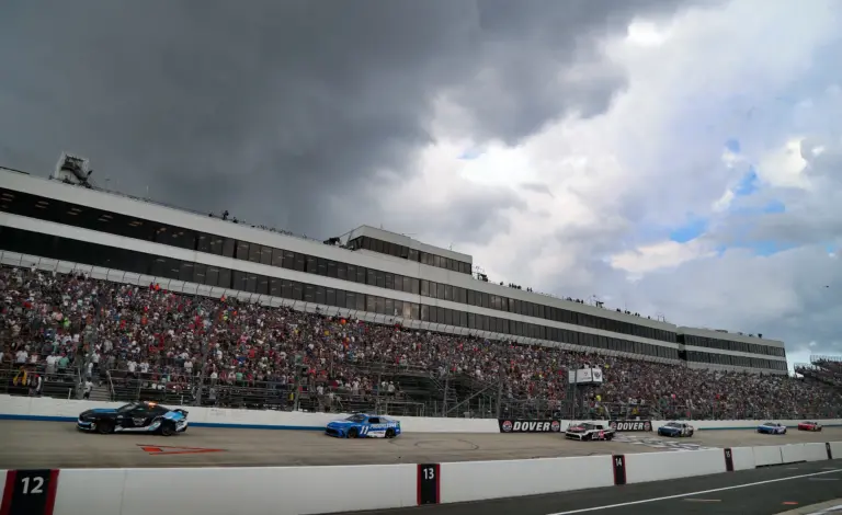 2026; Jul 20, 2025; Dover, Delaware, USA; NASCAR Cup Series driver Denny Hamlin (11) leads under caution as weather moves in during the Autotrader EchoPark Automotive 400 at Dover Motor Speedway. Mandatory Credit: Matthew O'Haren-Imagn Images