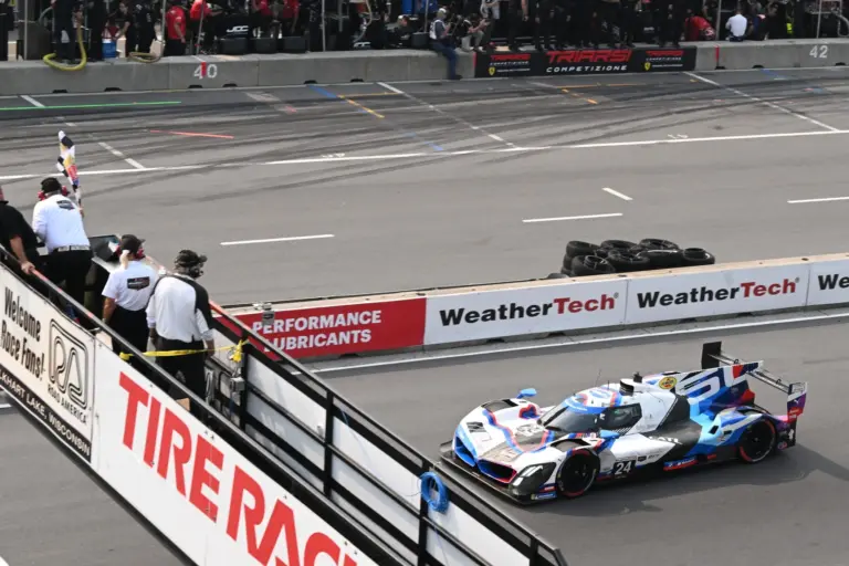 The GTP Team RLL BMW M Hybrid of Philipp Eng and Dries Vanthoor (24) takes the checkered flag to win the IMSA Motul SportsCar Grand Prix on Sunday, August 3, 2025, at Road America in Elkhart Lake, Wisconsin.