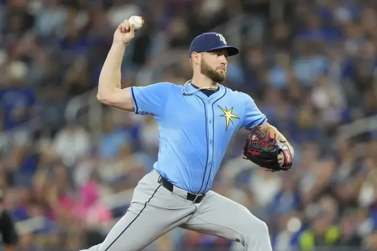 Adrian Houser signs with the San Francisco Giants.