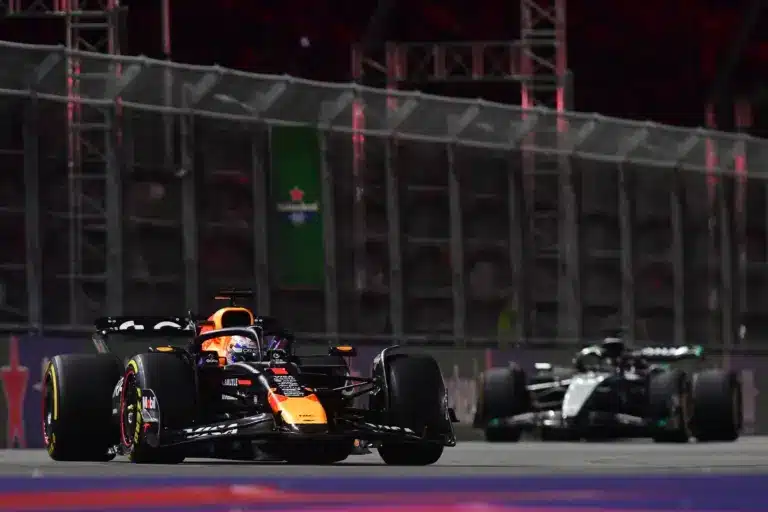 F1; Nov 21, 2025; Las Vegas, NV, USA; Red Bull Racing driver Max Verstappen (1) leads Mercedes driver George Russell (63) during the Las Vegas Grand Prix at Las Vegas Strip Circuit. Mandatory Credit: Gary A. Vasquez-Imagn Images